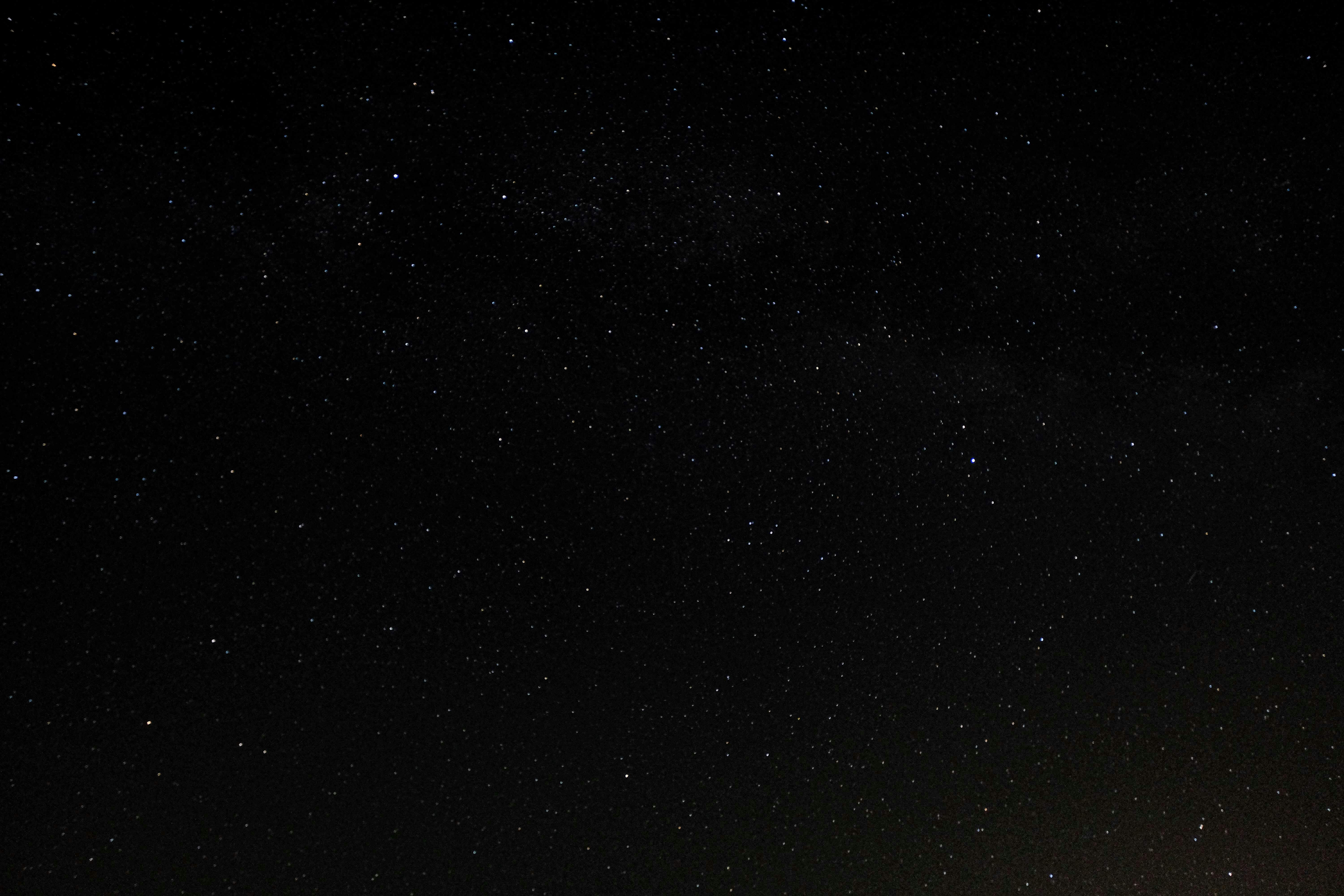 A view of stars scattered across a deep space background