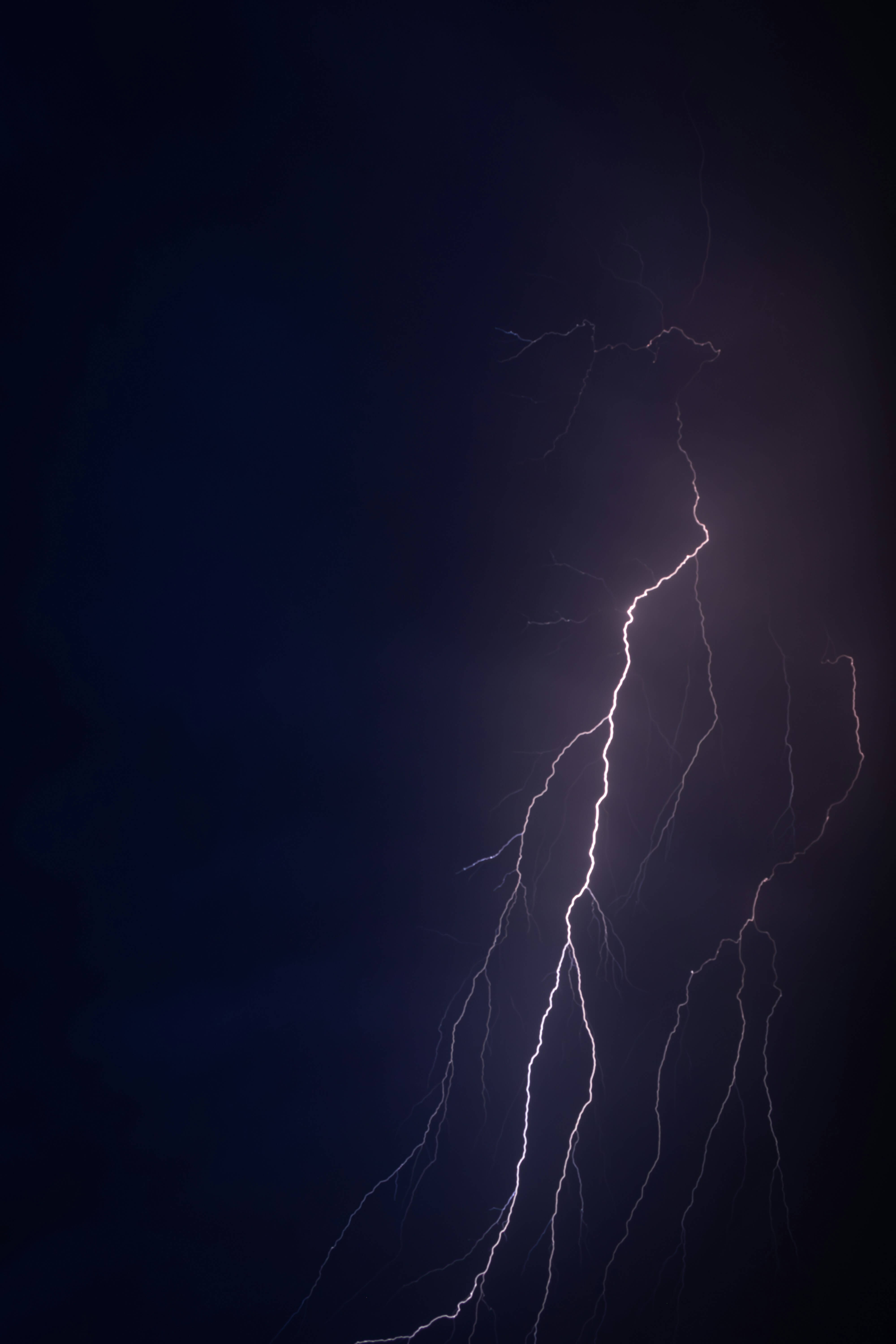 A powerful lightning strike against a dark sky